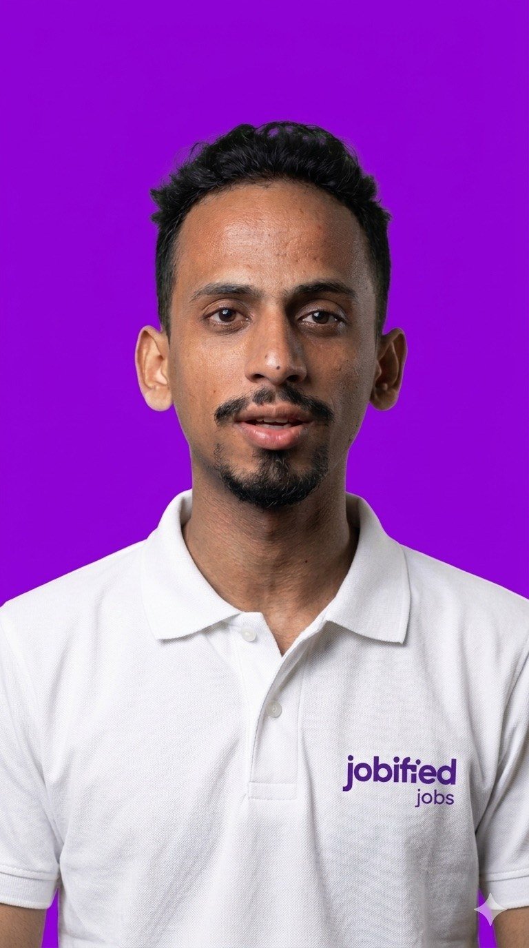 Ajmal Basheer in a white Jobified Jobs polo shirt against a purple background